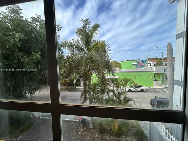 a view of a floor to a window and outside view