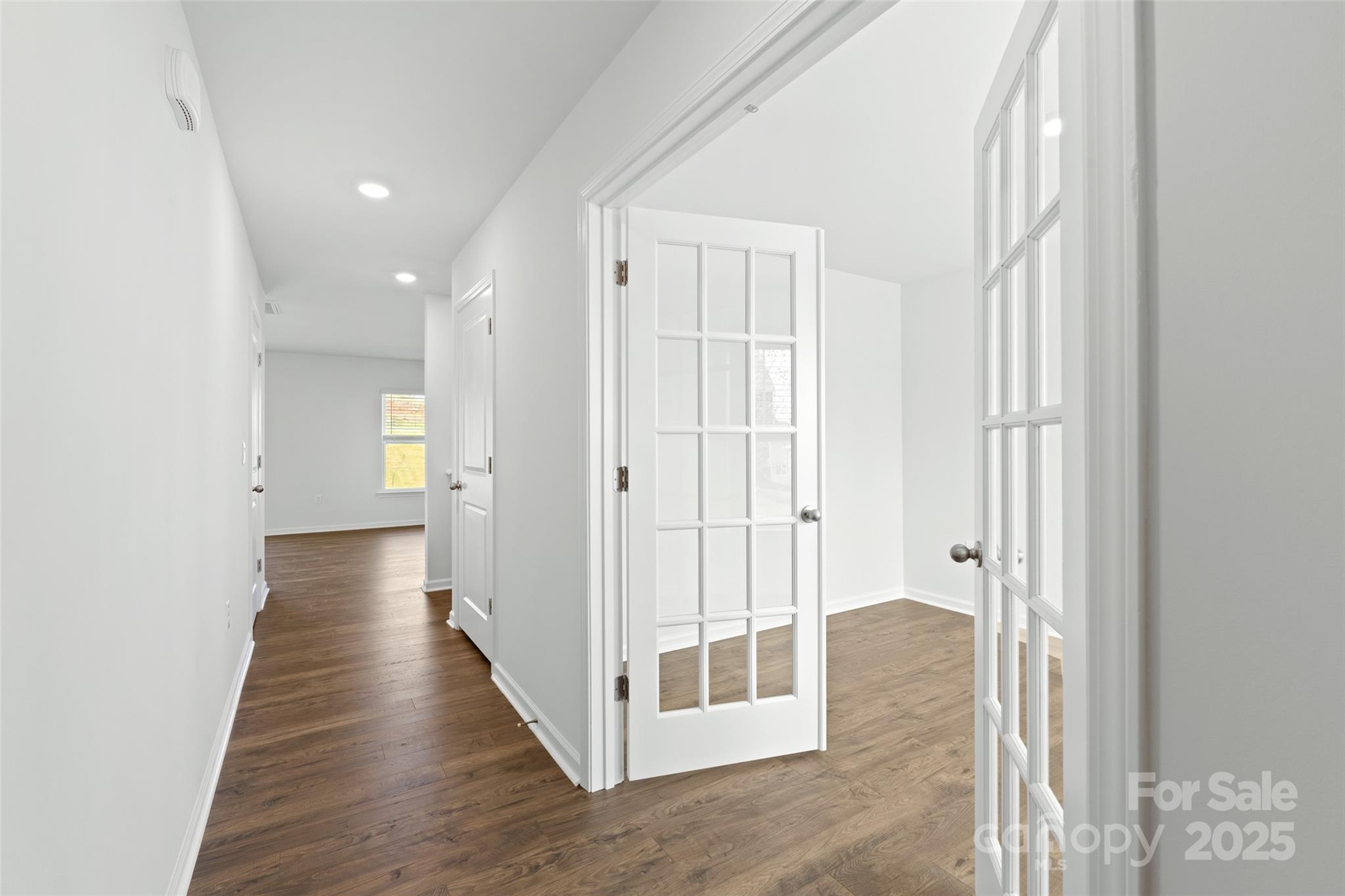 135 Callie River Clyde, NC 28721 - Photo 11 of 18 a view of a hallway with wooden floor