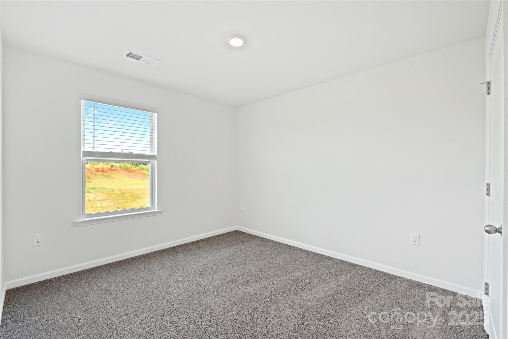135 Callie River Clyde, NC 28721 - Photo 17 of 18 an empty room with a window
