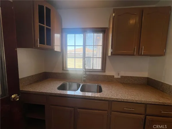 a kitchen with a sink and cabinets