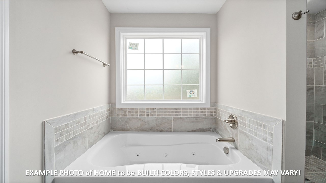 1830 McWhorter Road Cunningham, TN 37052 - Photo 17 of 46 a bathroom with a bath tub and a shower