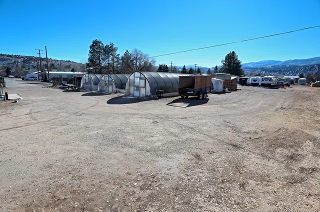 a view of a road with a building in the background