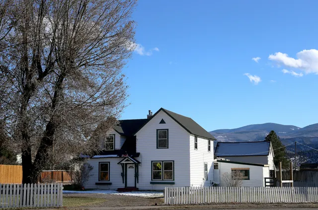 a view of a lake with outdoor seating