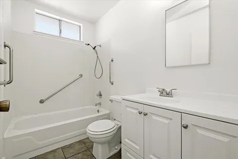 a bathroom with a sink a toilet and a bathtub