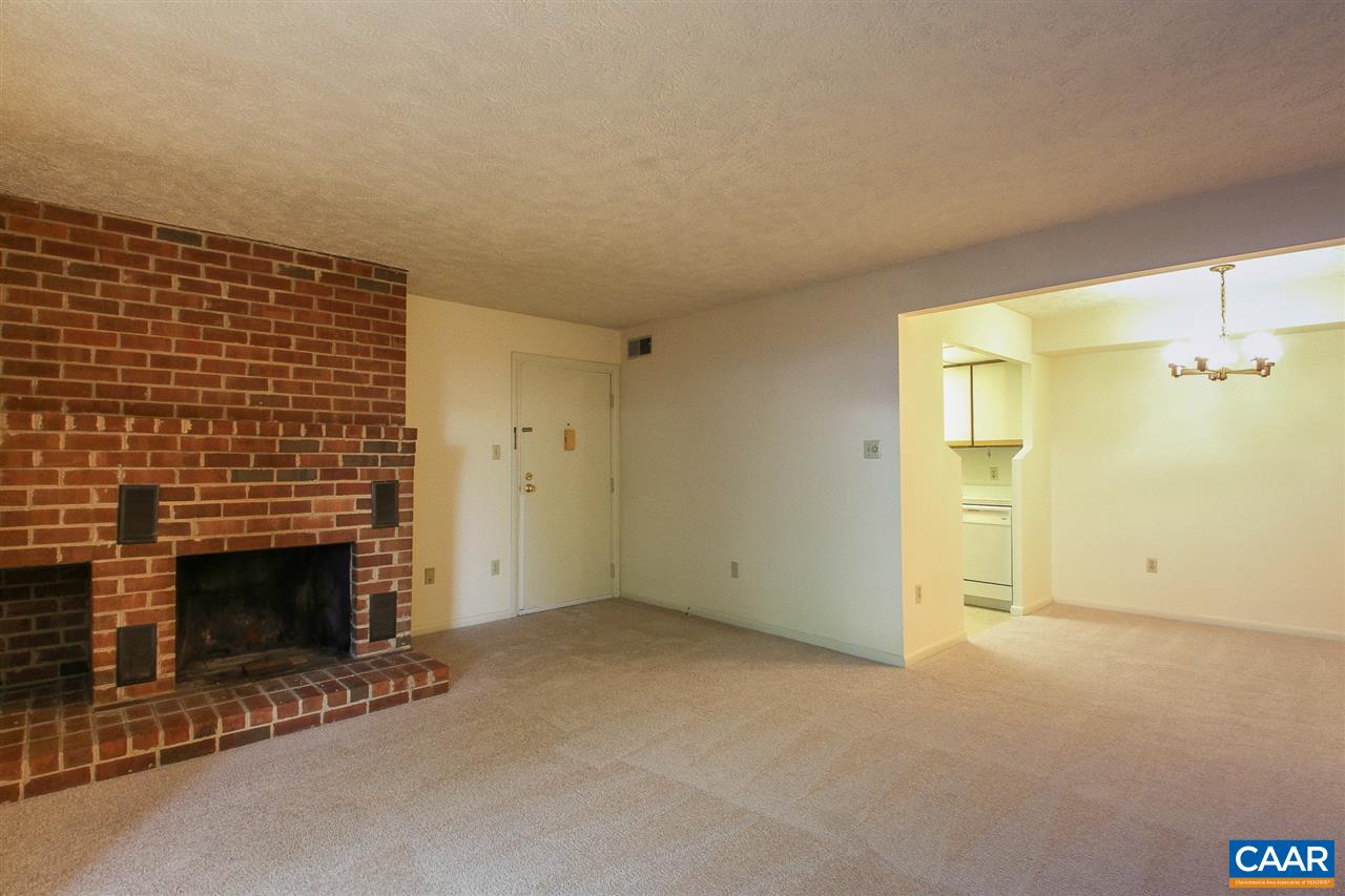 130 Turtle Creek Road, Unit 4 Charlottesville, VA 22901 - Photo 2 of 13 an empty room with a fireplace