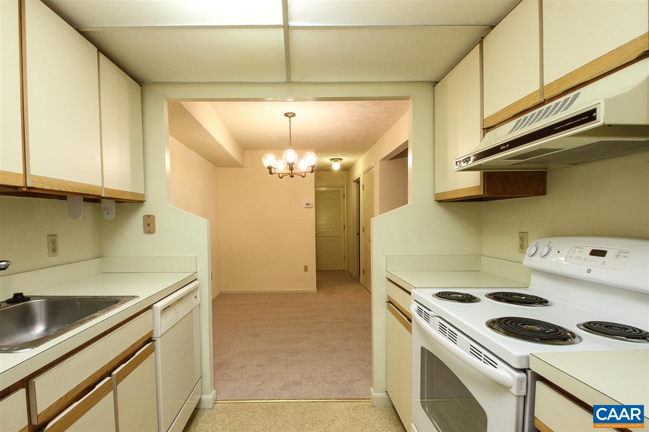 130 Turtle Creek Road, Unit 4 Charlottesville, VA 22901 - Photo 6 of 13 a kitchen that has a sink a stove and a microwave