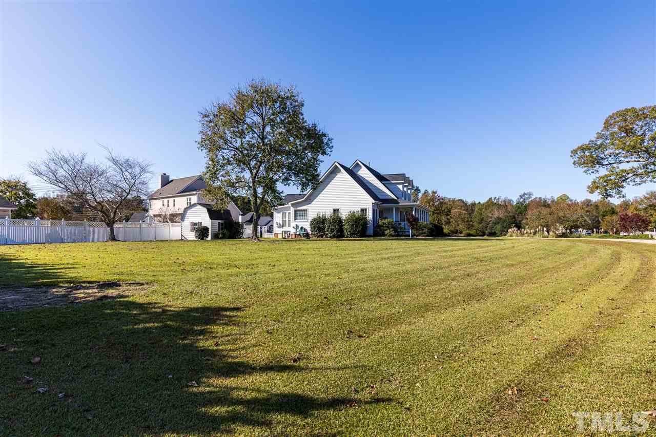 1008 Red Brick Road Garner, NC 27529 - Photo 3 of 30 a swimming pool with wooden fence