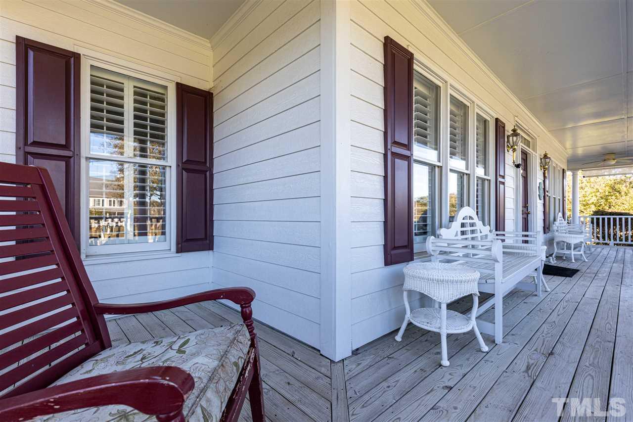 1008 Red Brick Road Garner, NC 27529 - Photo 5 of 30 a view of a balcony dining table and chairs