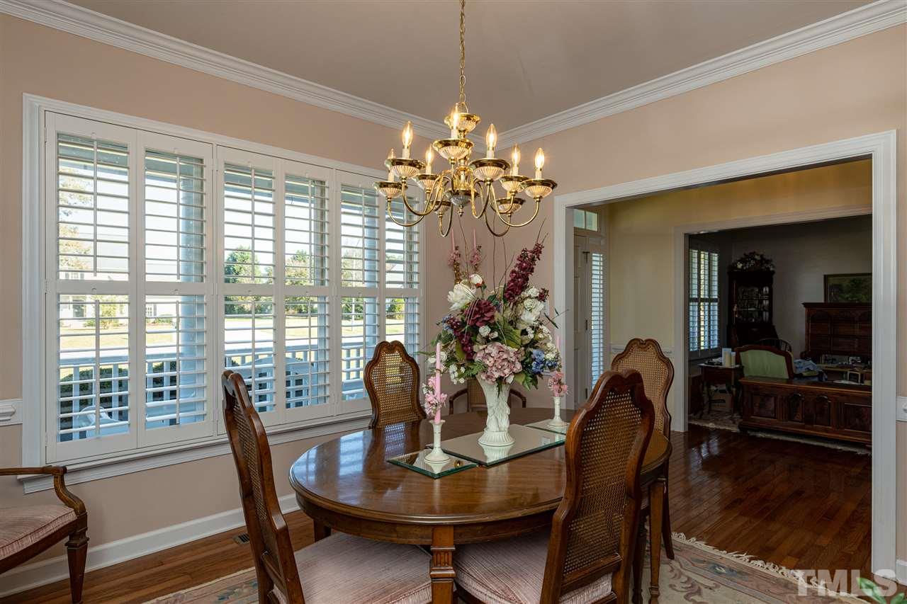 1008 Red Brick Road Garner, NC 27529 - Photo 8 of 30 a view of a dining room with furniture window and wooden floor