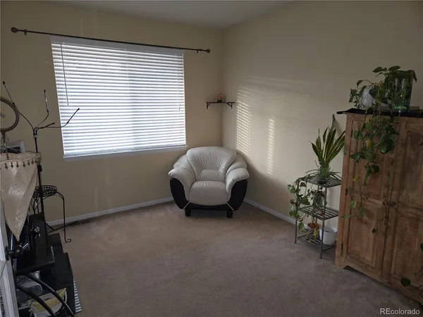 a livingroom with window and a couch