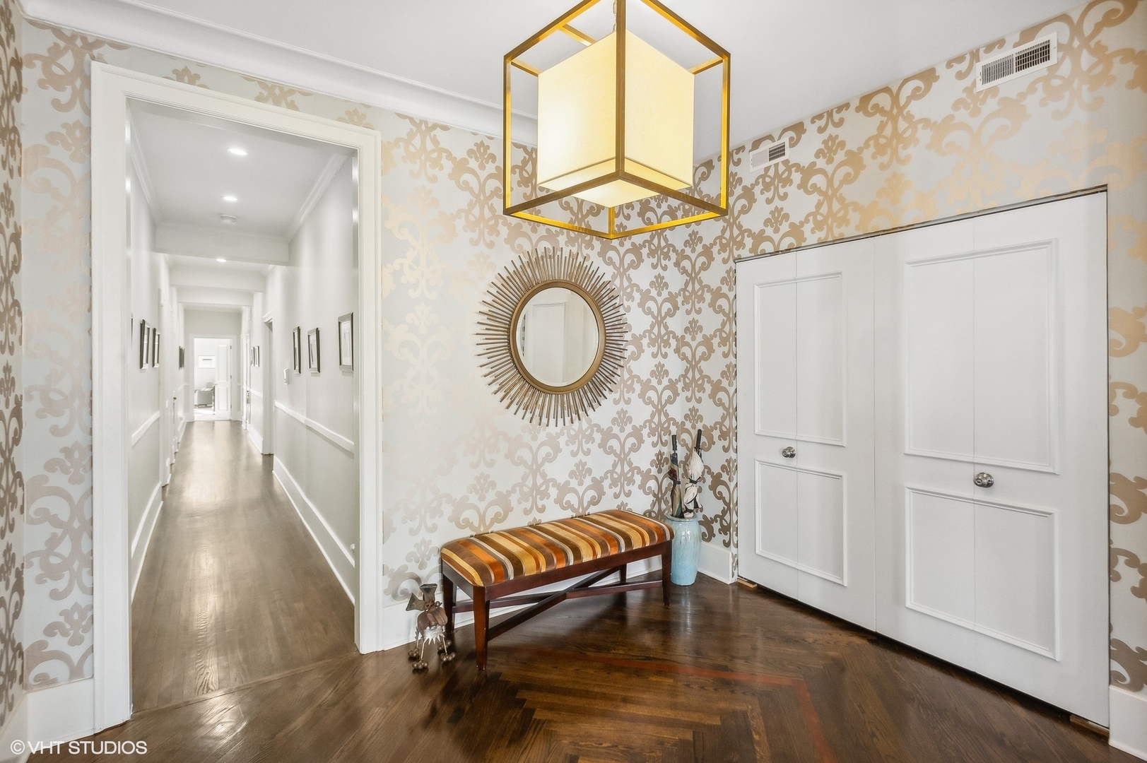 443 West Aldine Avenue, Unit 3 Chicago, IL 60657 - Photo 11 of 19 a hallway with a wooden floor and a chair
