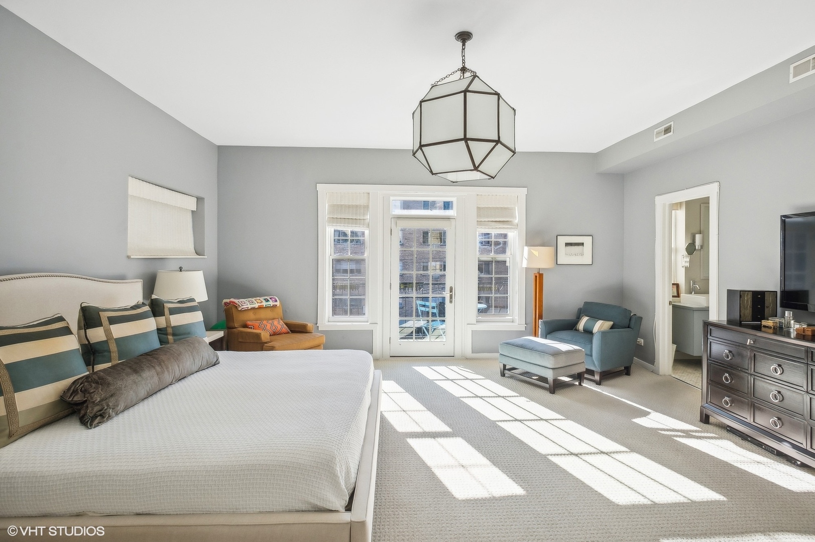 443 West Aldine Avenue, Unit 3 Chicago, IL 60657 - Photo 14 of 19 a bedroom with furniture and a chandelier