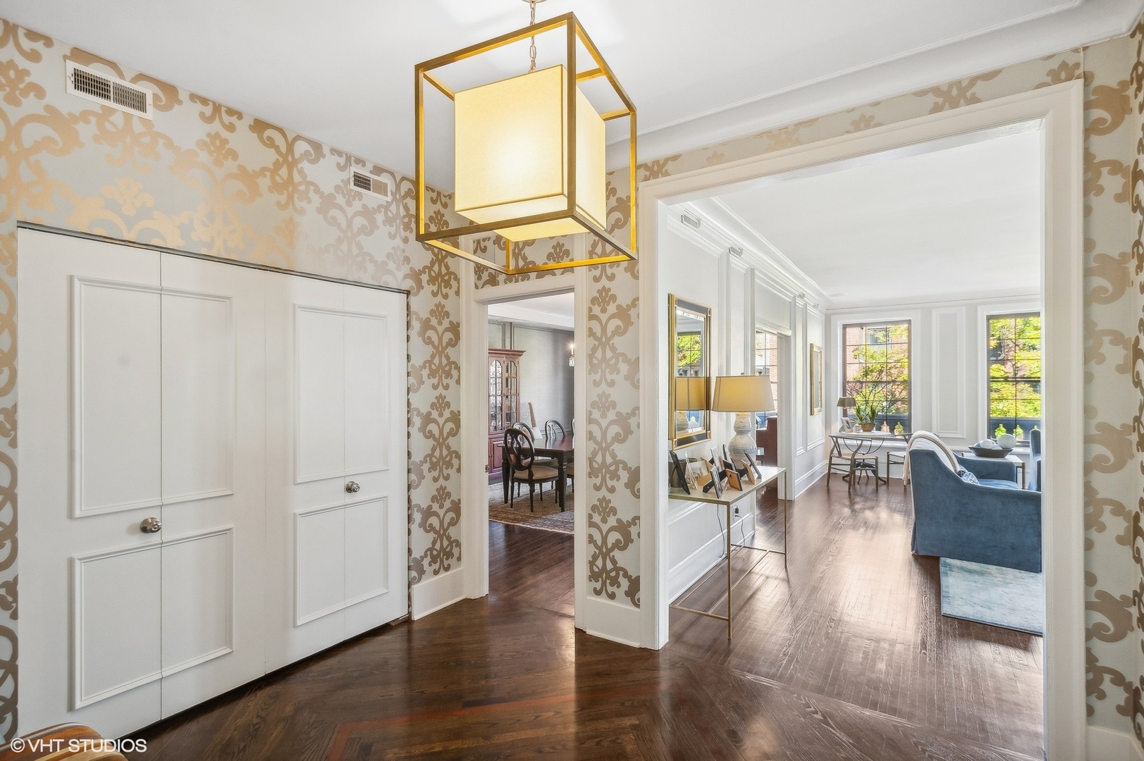 443 West Aldine Avenue, Unit 3 Chicago, IL 60657 - Photo 2 of 19 a living room with furniture a wooden floor and a refrigerator