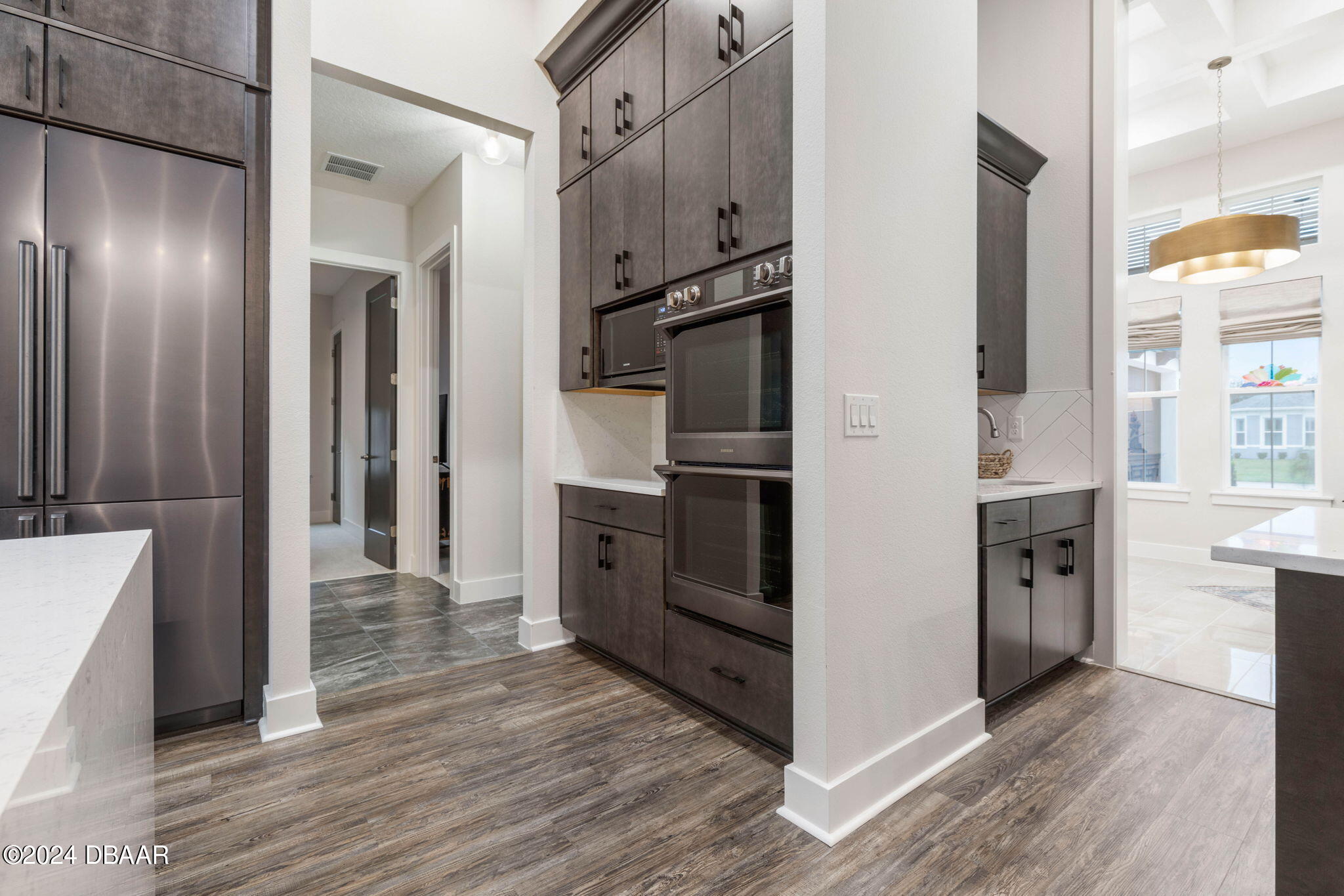 1405 Lilly Anne Circle Ormond Beach, FL 32174 - Photo 13 of 76 a kitchen with cabinets and stainless steel appliances