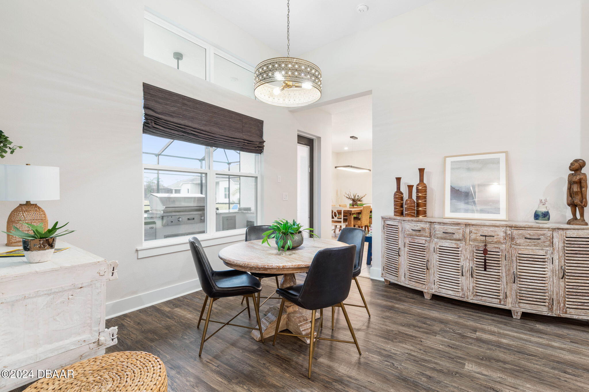 1405 Lilly Anne Circle Ormond Beach, FL 32174 - Photo 17 of 76 a dining room with furniture a chandelier and wooden floor