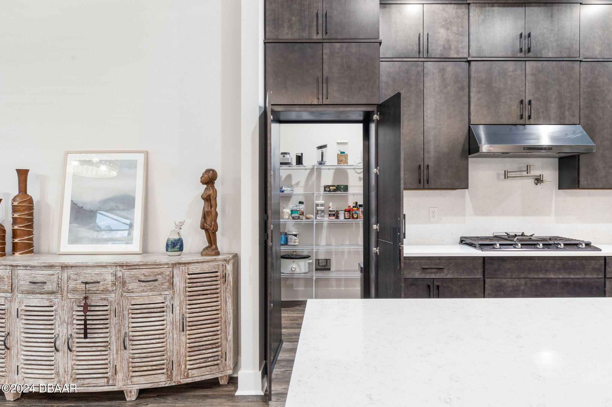 1405 Lilly Anne Circle Ormond Beach, FL 32174 - Photo 18 of 76 a kitchen with stainless steel appliances kitchen island granite countertop a refrigerator a stove and a sink with wooden floor