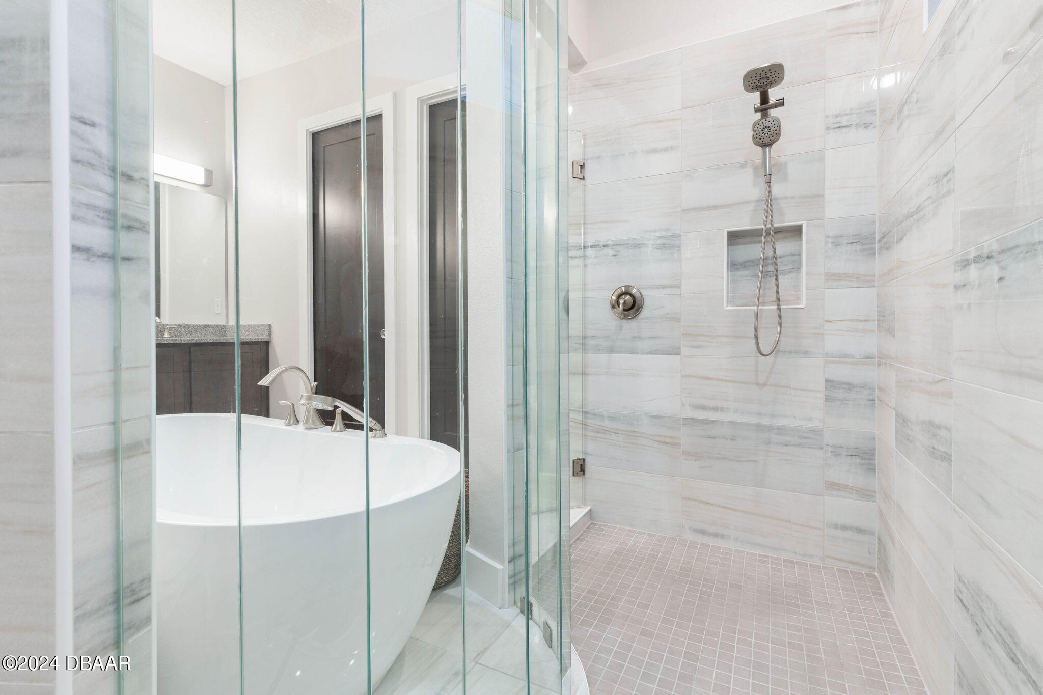 1405 Lilly Anne Circle Ormond Beach, FL 32174 - Photo 43 of 76 a bathroom with a tub and a shower