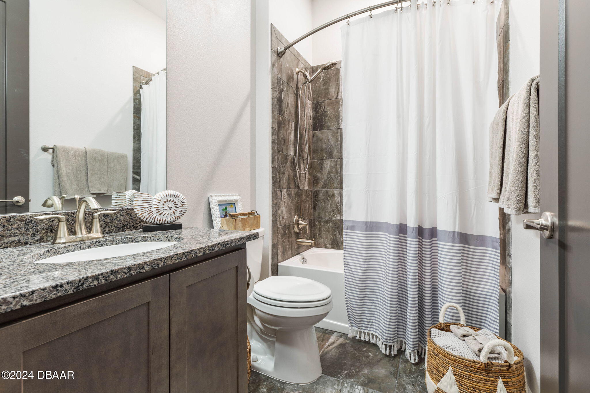 1405 Lilly Anne Circle Ormond Beach, FL 32174 - Photo 50 of 76 a bathroom with a granite countertop sink a toilet and a mirror