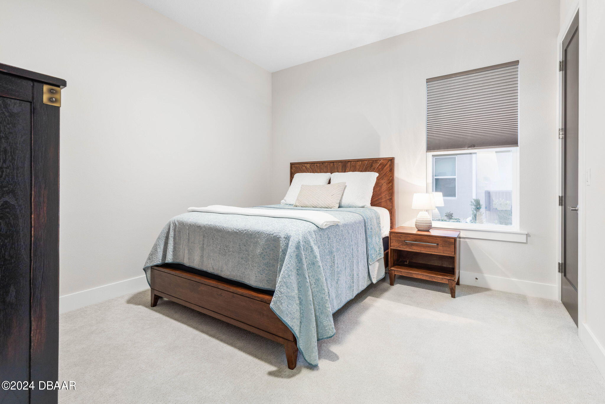 1405 Lilly Anne Circle Ormond Beach, FL 32174 - Photo 51 of 76 a bed and a night stand sitting in a bedroom