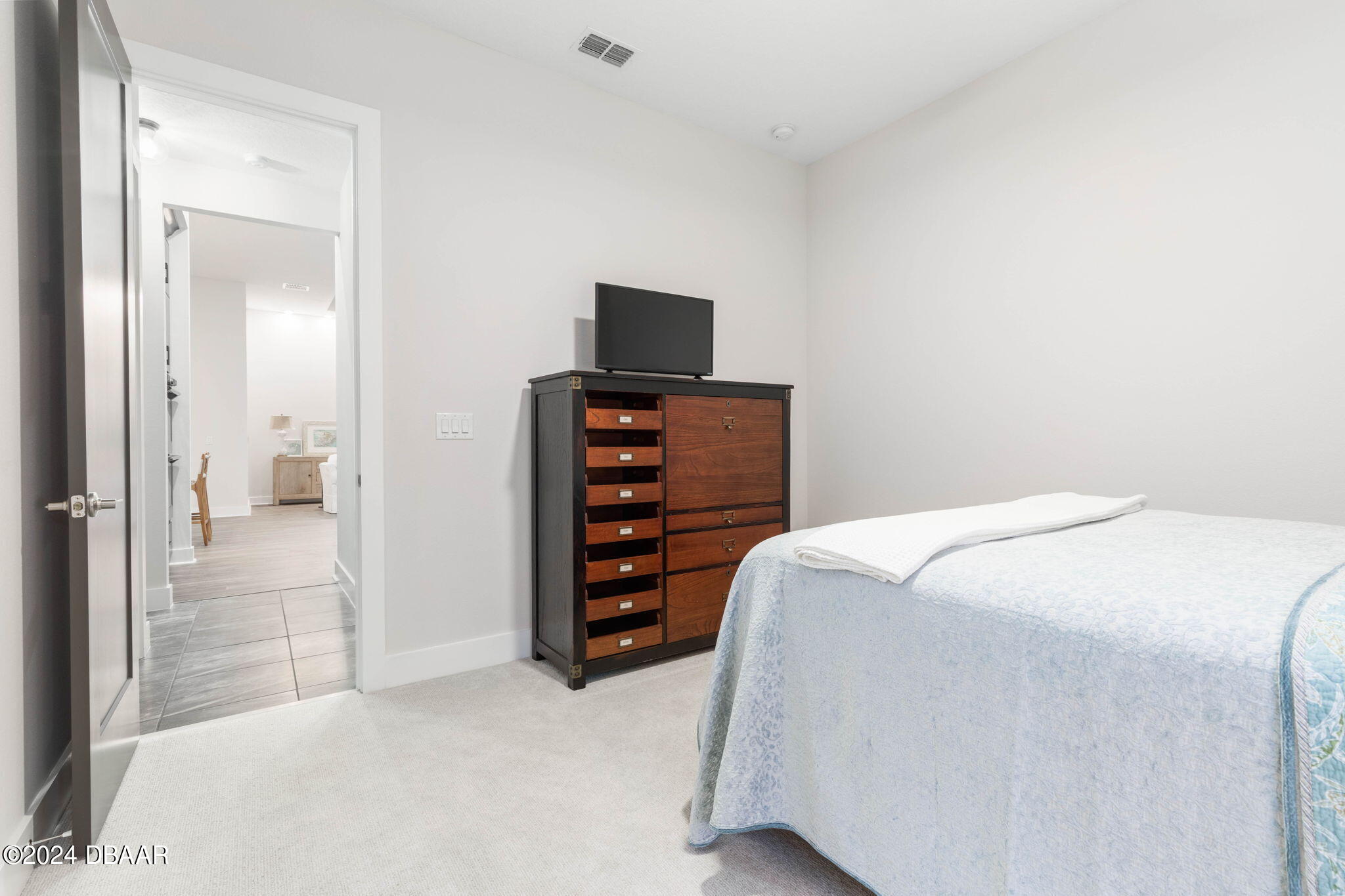 1405 Lilly Anne Circle Ormond Beach, FL 32174 - Photo 52 of 76 a bedroom with a bed and a television