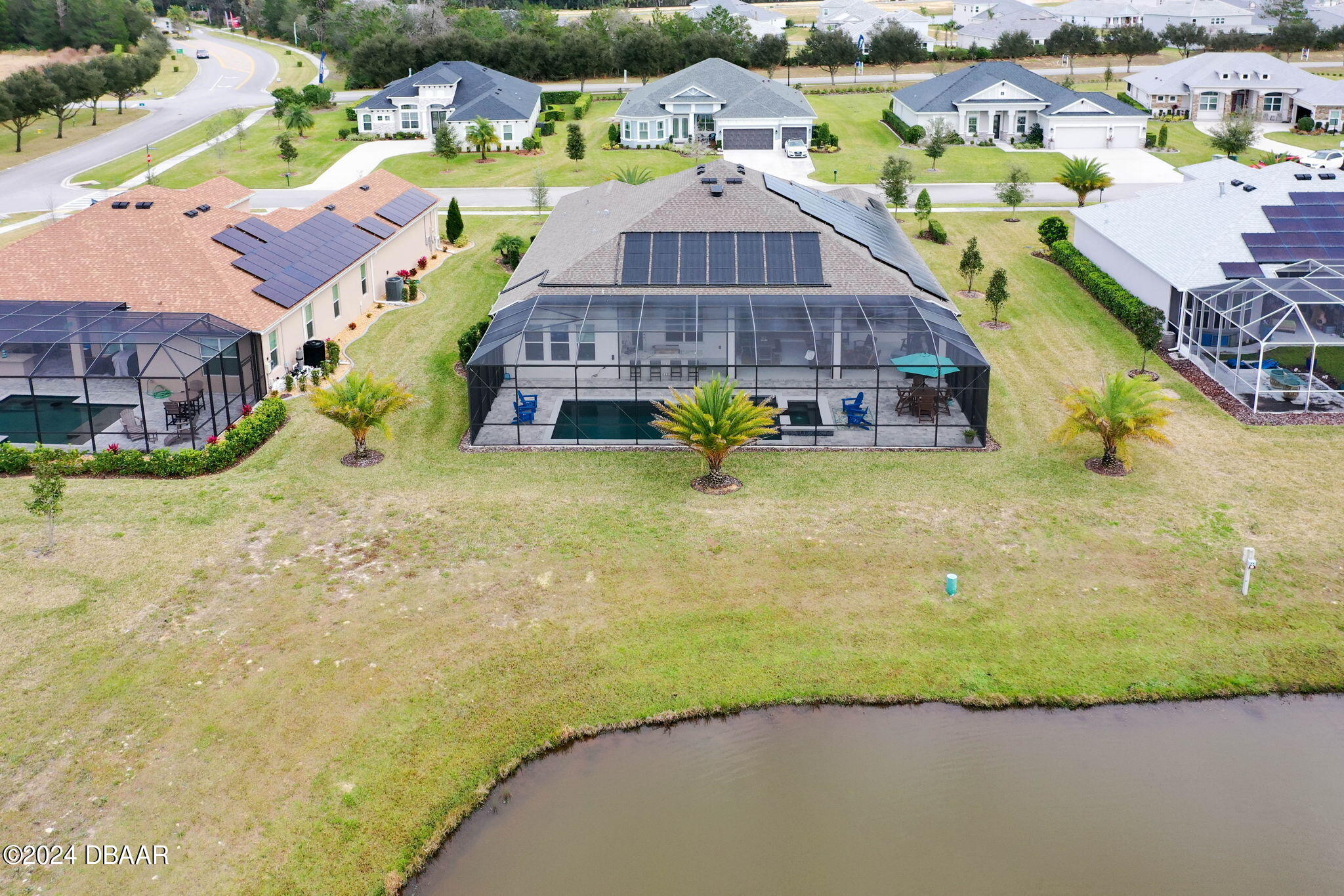 1405 Lilly Anne Circle Ormond Beach, FL 32174 - Photo 59 of 76 a view of a house with a swimming pool and sitting area