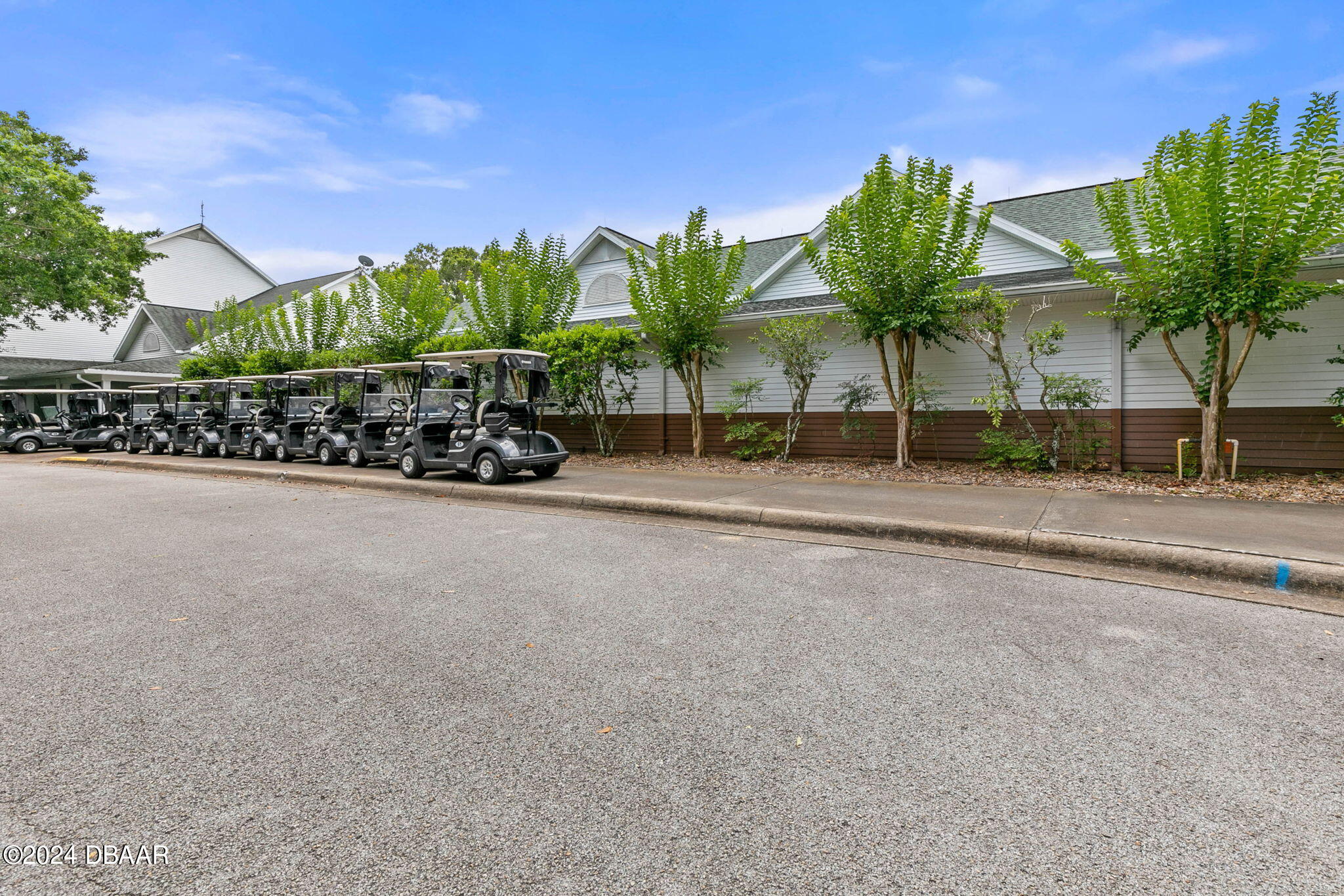 1405 Lilly Anne Circle Ormond Beach, FL 32174 - Photo 76 of 76 a view of a street with a building in front of it