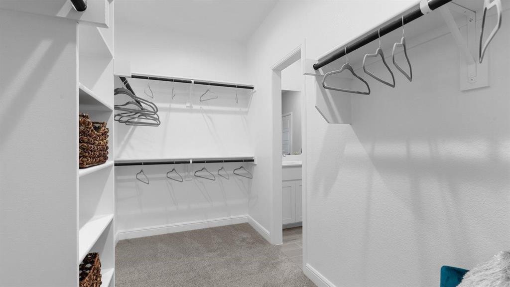 107 Goodnight Court Cleburne, TX 76033 - Photo 20 of 36 a view of walk in closet with empty racks