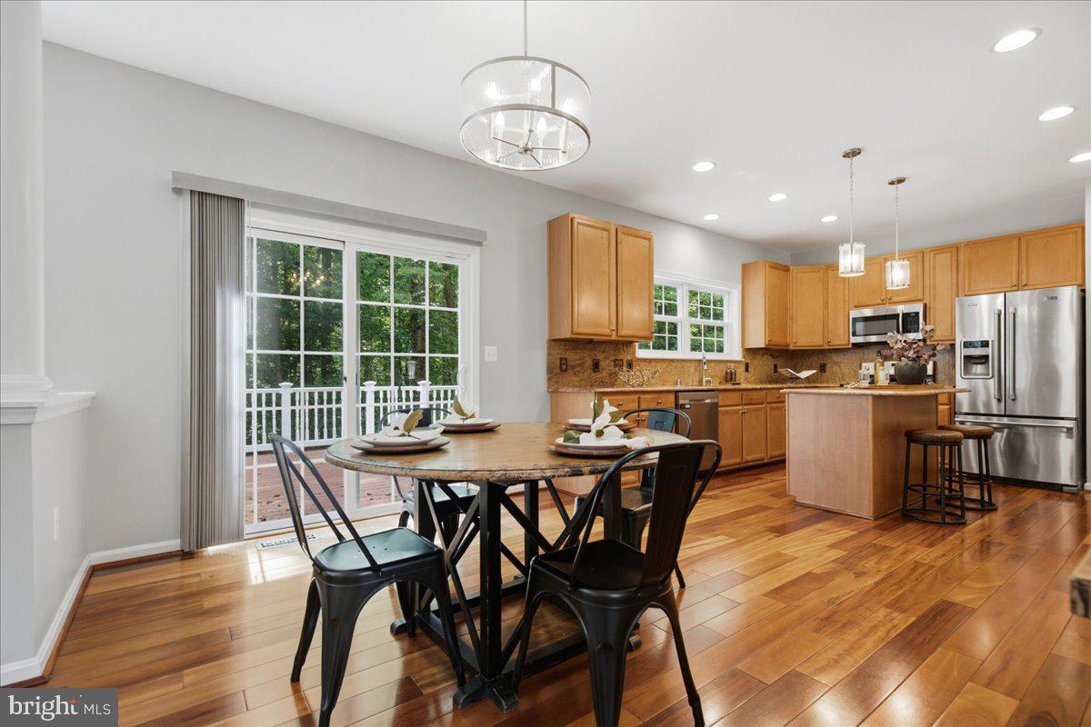 2424 Springbrook Court Huntingtown, MD 20639 - Photo 31 of 103 a view of a dining room with furniture window and wooden floor