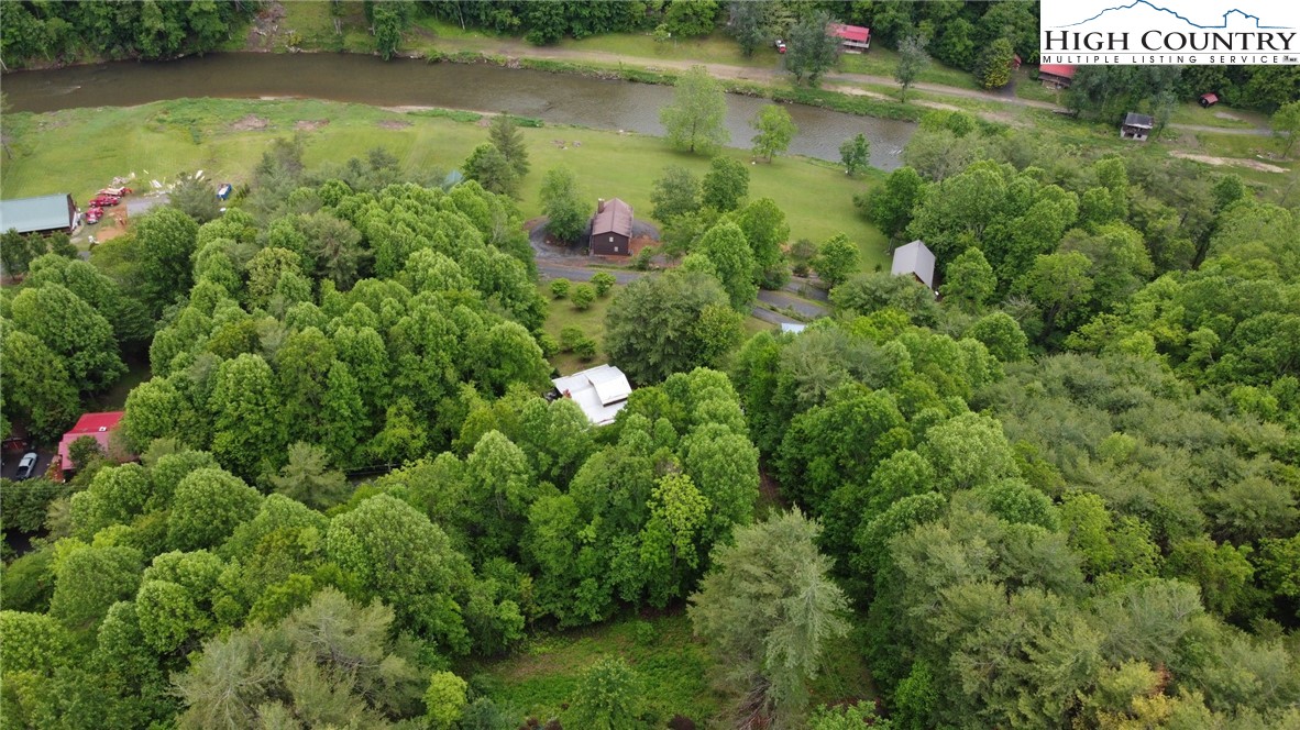 710 River Hills Road Lansing, NC 28643 - Photo 37 of 38 a view of a lake with a yard