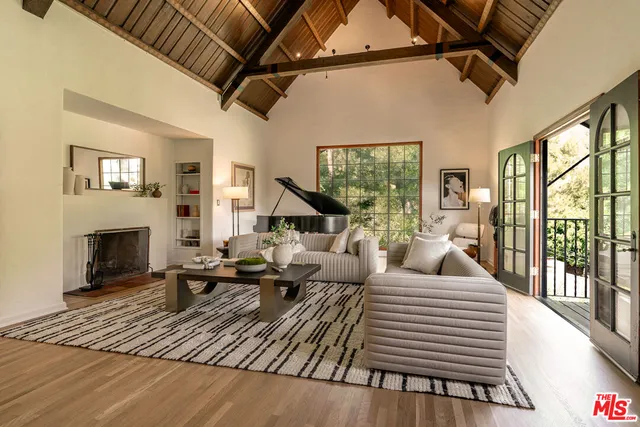 a living room with furniture or fireplace and a floor to ceiling window