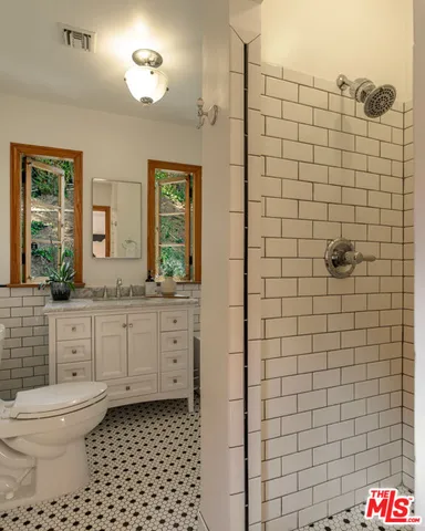 a spacious bedroom with a bed and a couch