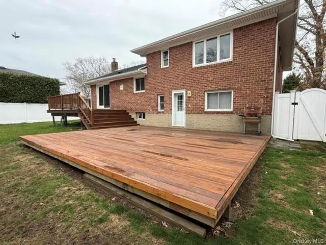 a patio with a table and chairs