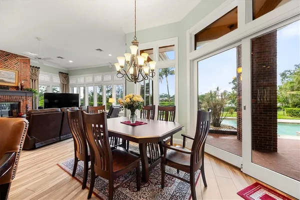 a view of a lake with a yard and potted plants
