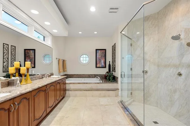 a view of a lake with a table and chairs under an umbrella