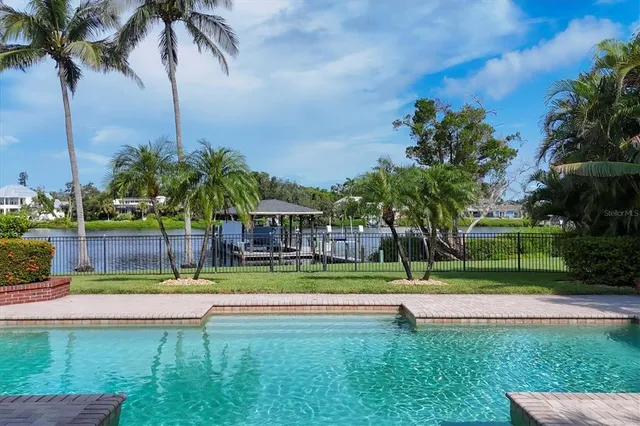 a view of a lake with a sitting area