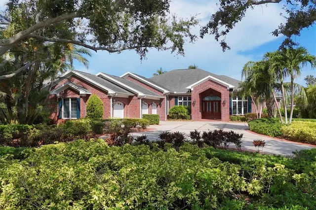 a view of a house with swimming pool yard and a patio