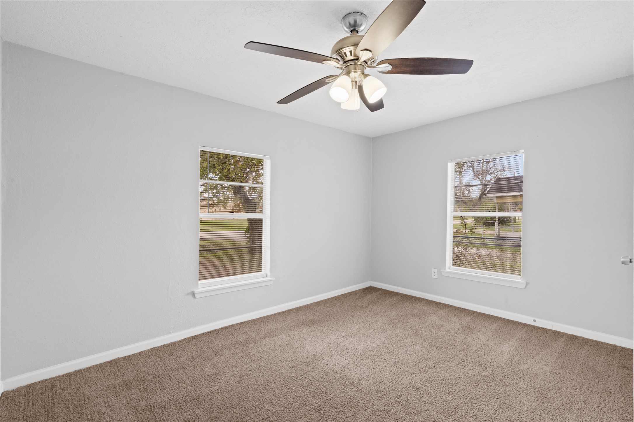 419 North Parrish Street Angleton, TX 77515 - Photo 13 of 25 a view of an empty room with a window