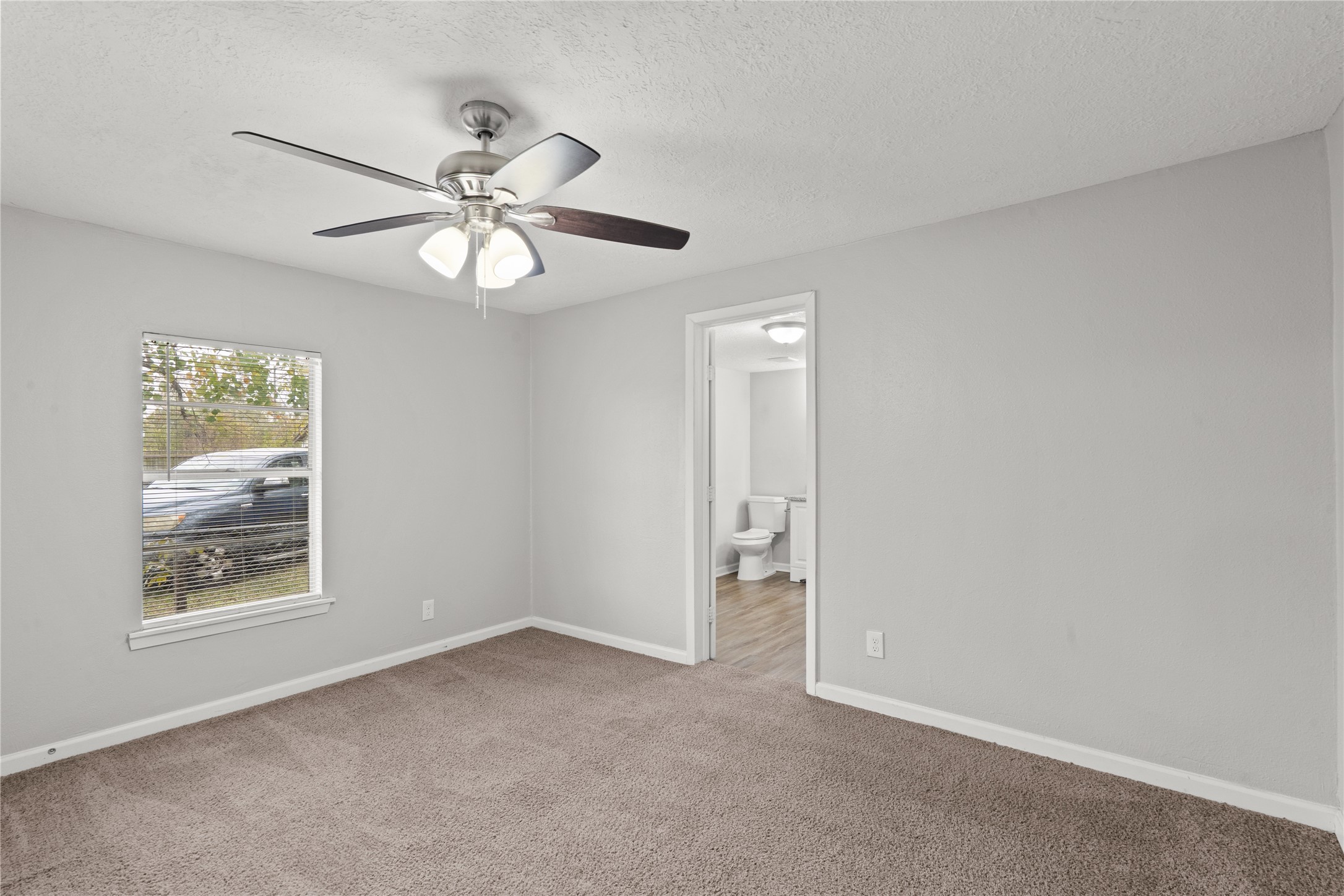 419 North Parrish Street Angleton, TX 77515 - Photo 4 of 25 a view of an empty room with a window
