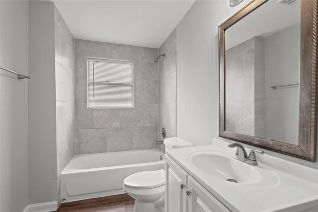 a bathroom with a sink toilet and bathtub