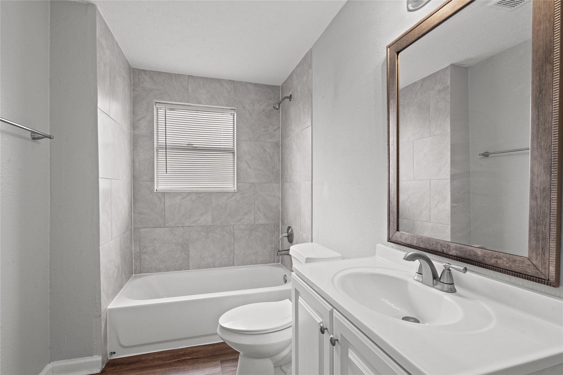 419 North Parrish Street Angleton, TX 77515 - Photo 8 of 25 a bathroom with a sink toilet and bathtub