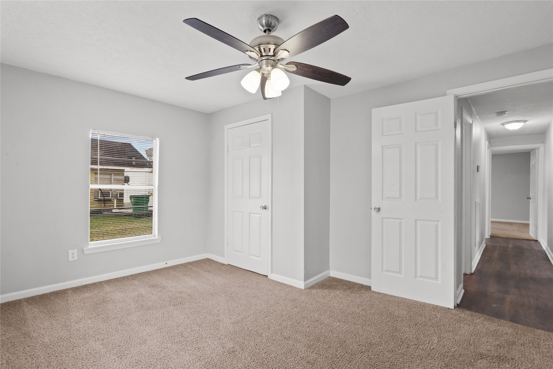 419 North Parrish Street Angleton, TX 77515 - Photo 10 of 25 a view of an empty room with a window