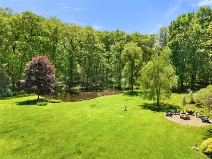 a view of a grassy field with trees