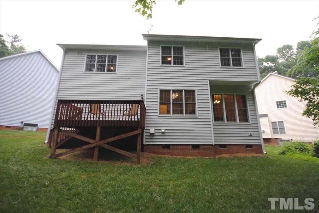 6915 Brigmore Court Raleigh, NC 27617 - Photo 22 of 25 a view of a house with a yard