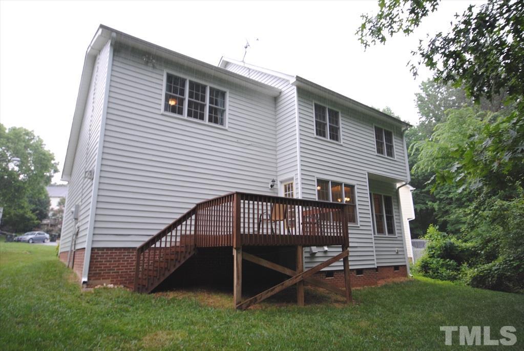 6915 Brigmore Court Raleigh, NC 27617 - Photo 23 of 25 a view of a house with a yard