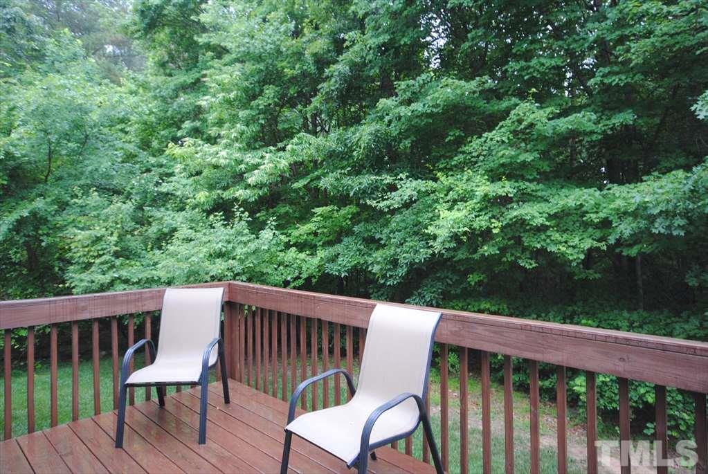 6915 Brigmore Court Raleigh, NC 27617 - Photo 24 of 25 a view of a wooden deck with chairs