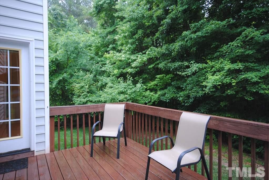 6915 Brigmore Court Raleigh, NC 27617 - Photo 25 of 25 a view of a chair and table on the wooden deck