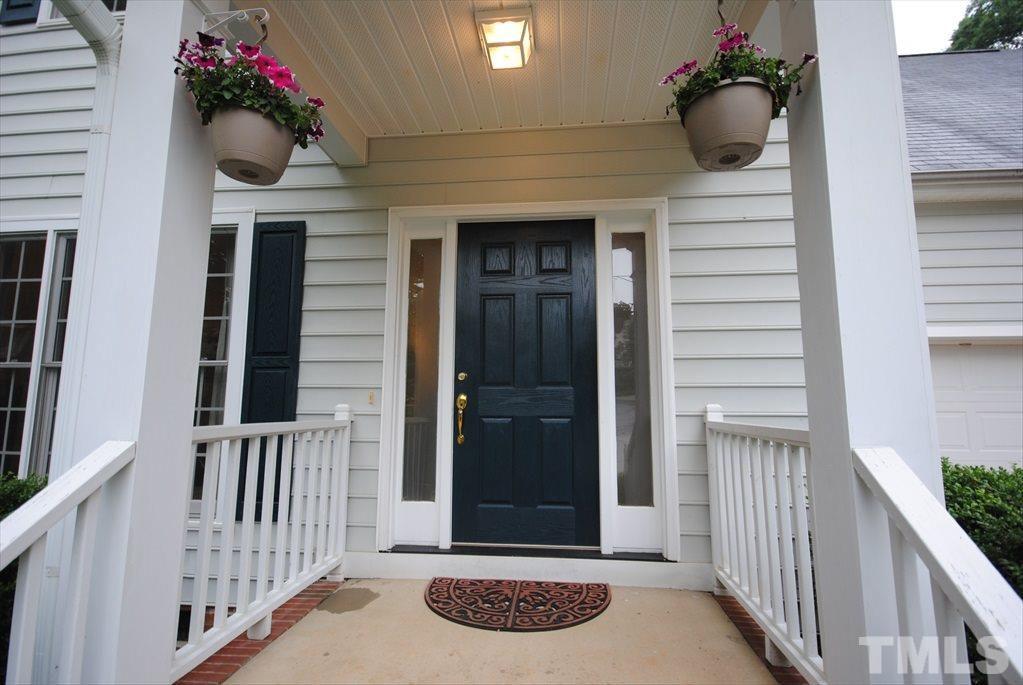 6915 Brigmore Court Raleigh, NC 27617 - Photo 5 of 25 a view of a porch with a potted plant