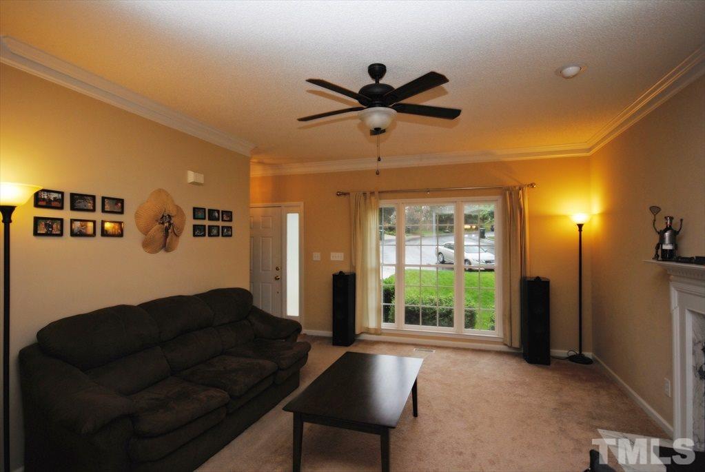 6915 Brigmore Court Raleigh, NC 27617 - Photo 7 of 25 a living room with furniture and a large window