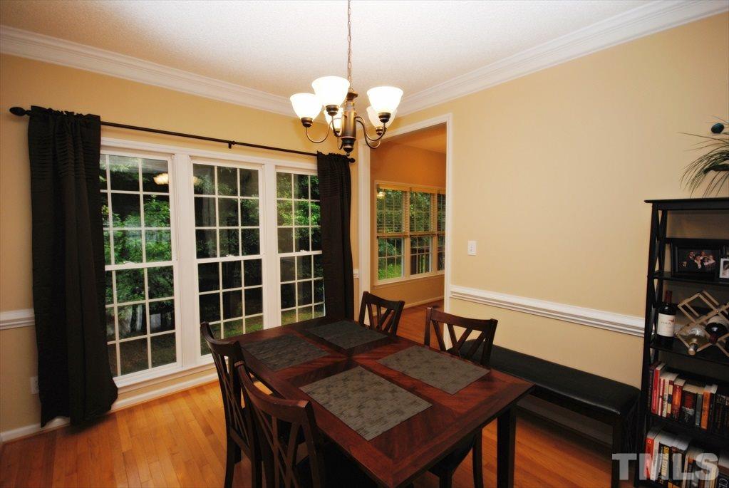 6915 Brigmore Court Raleigh, NC 27617 - Photo 10 of 25 a view of a dining room with furniture and a window