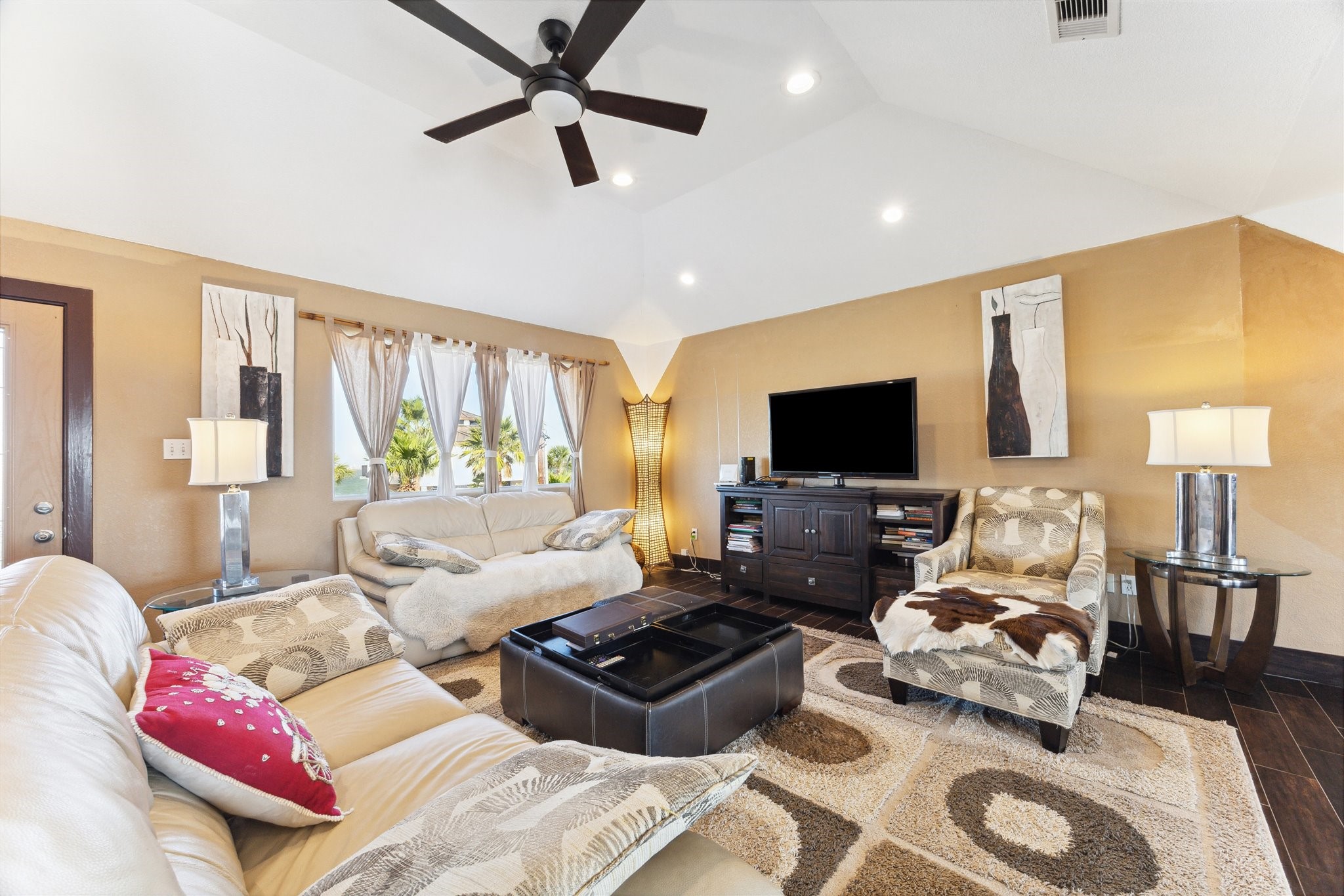 410 Isles End Road Tiki Island, TX 77554 - Photo 3 of 13 a living room with furniture and a flat screen tv